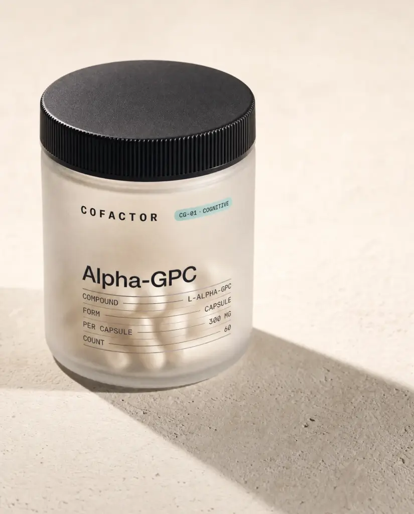 Alpha-GPC jar at a three-quarter angle, frosted glass with a matte black cap.